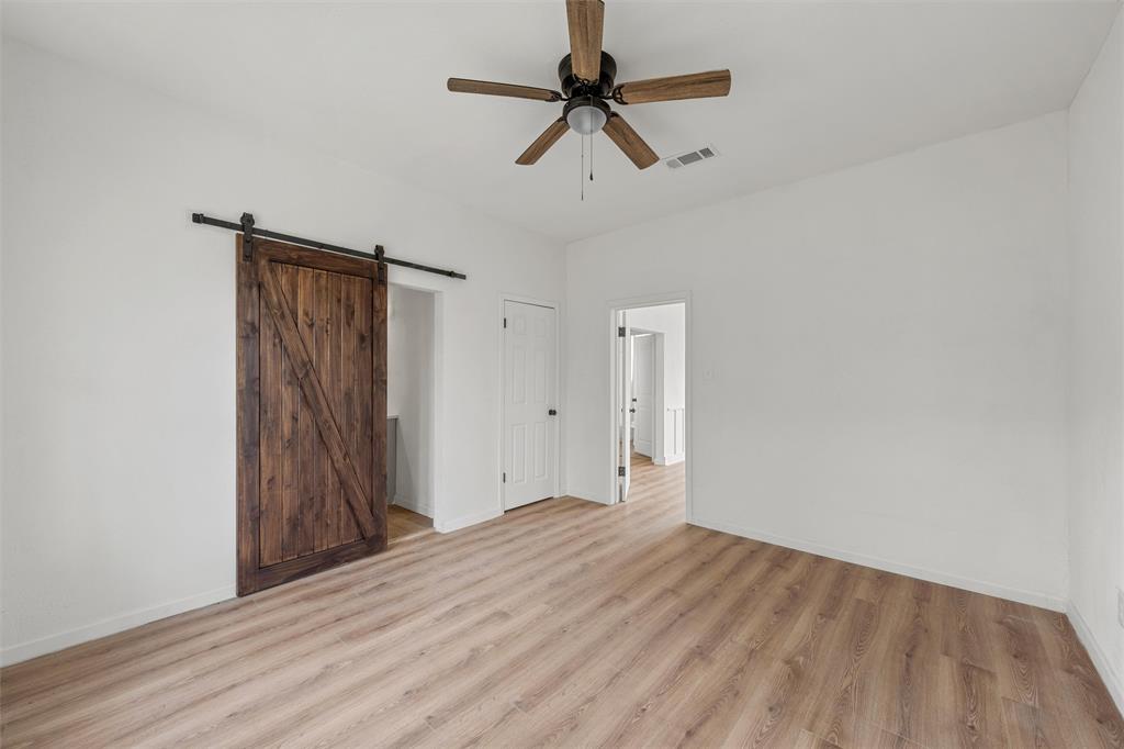 1504 Proctor Avenue Waco, TX 76708 - Photo 16 of 25 a view of room with hardwood floor and ceiling fan