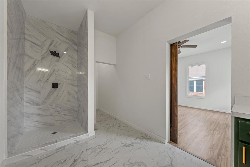 1504 Proctor Avenue Waco, TX 76708 - Photo 20 of 25 a bathroom with a glass shower door