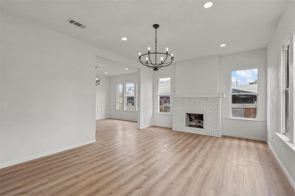 1504 Proctor Avenue Waco, TX 76708 - Photo 3 of 25 a view of empty room with wooden floor and fireplace