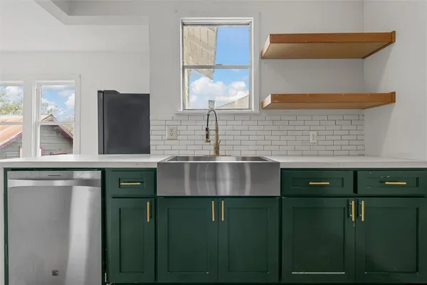 a kitchen with a sink and a window