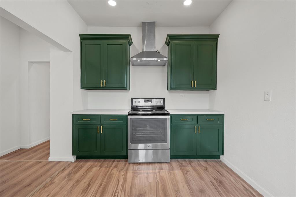 1504 Proctor Avenue Waco, TX 76708 - Photo 7 of 25 a kitchen with a refrigerator and a stove top oven