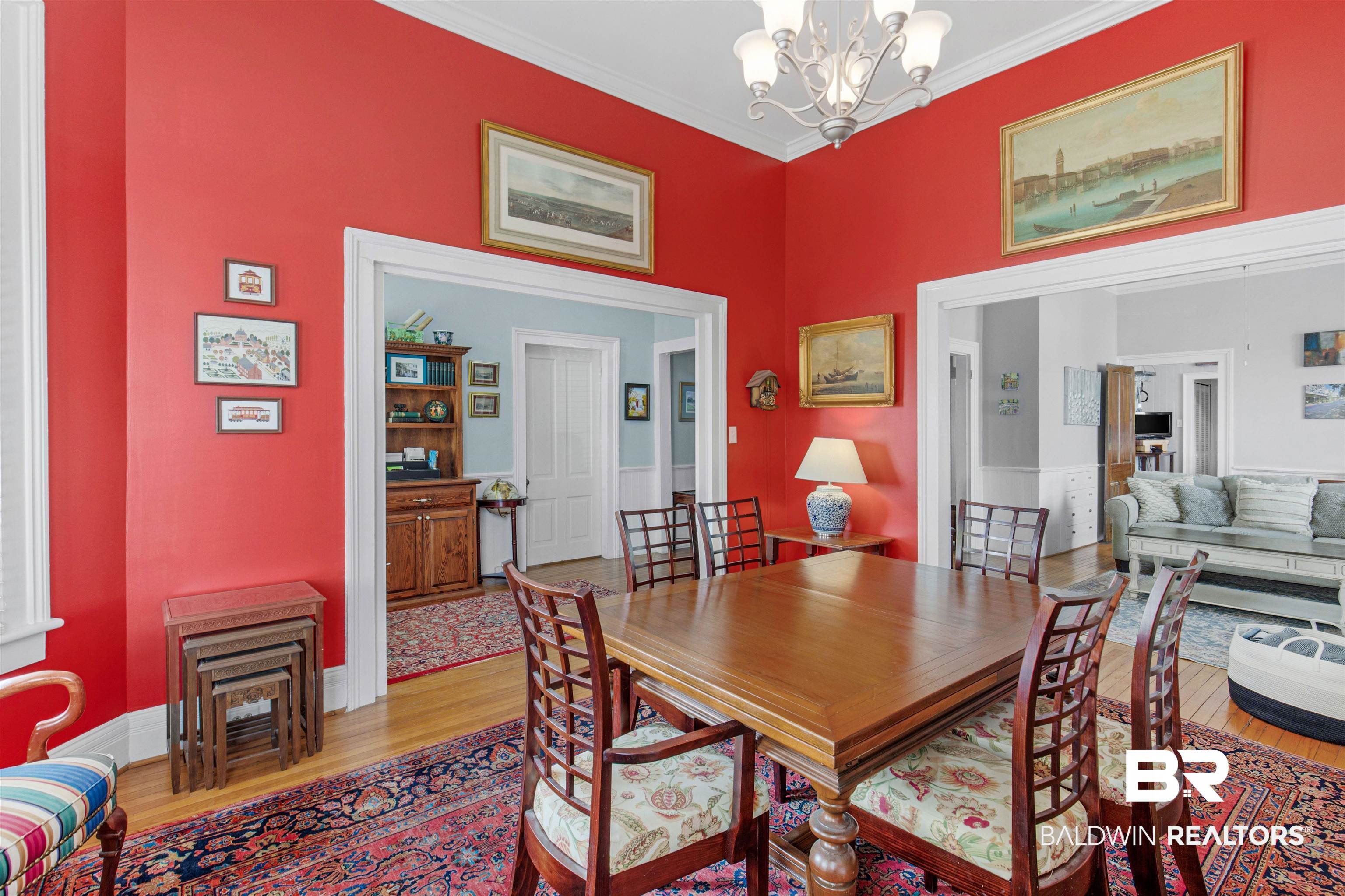 120 Espejo Street Mobile, AL 36604 - Photo 5 of 36 Dining area featuring light wood-style floors, baseboards, a chandelier, and crown molding