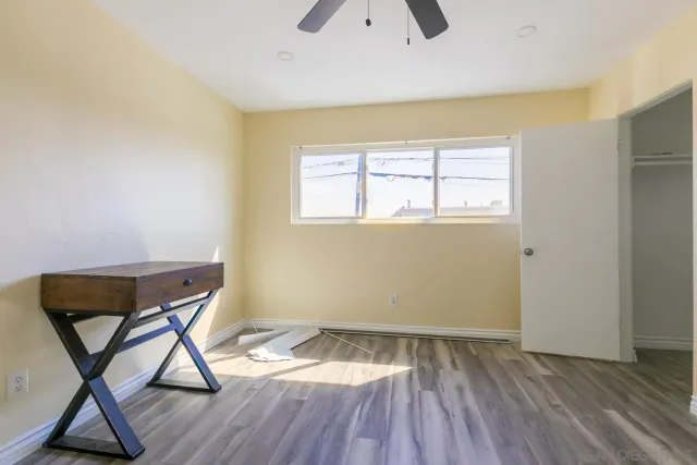 a view of a room with furniture window and wooden floor