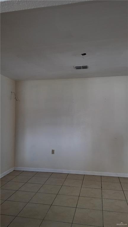 612 West Ramirez Street Rio Grande City, TX 78582 - Photo 21 of 40 Spare room featuring light tile patterned floors and baseboards