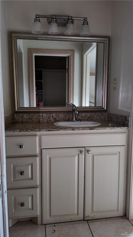 612 West Ramirez Street Rio Grande City, TX 78582 - Photo 24 of 40 Bathroom with vanity and tile patterned flooring