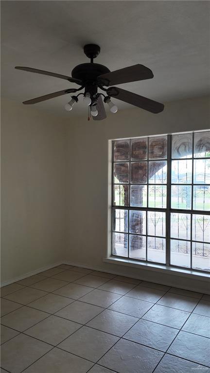 612 West Ramirez Street Rio Grande City, TX 78582 - Photo 30 of 40 Spare room with light tile patterned floors and a ceiling fan
