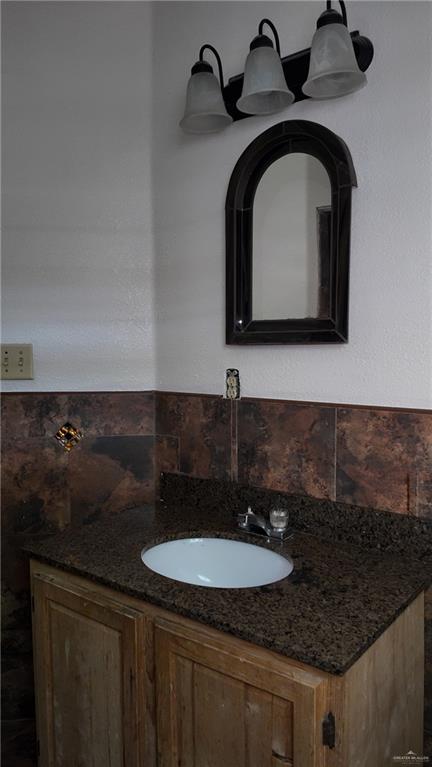 612 West Ramirez Street Rio Grande City, TX 78582 - Photo 32 of 40 Bathroom with vanity and tasteful backsplash