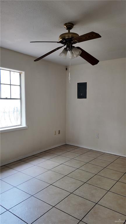 612 West Ramirez Street Rio Grande City, TX 78582 - Photo 33 of 40 Spare room with electric panel, light tile patterned floors, and ceiling fan