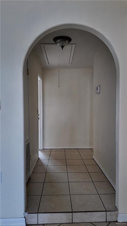 612 West Ramirez Street Rio Grande City, TX 78582 - Photo 36 of 40 Hall featuring light tile patterned floors and attic access