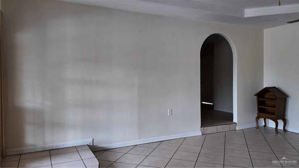 612 West Ramirez Street Rio Grande City, TX 78582 - Photo 38 of 40 Spare room with arched walkways and light tile patterned floors