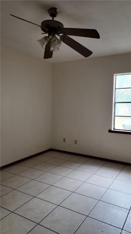 612 West Ramirez Street Rio Grande City, TX 78582 - Photo 40 of 40 Unfurnished room with light tile patterned floors and ceiling fan