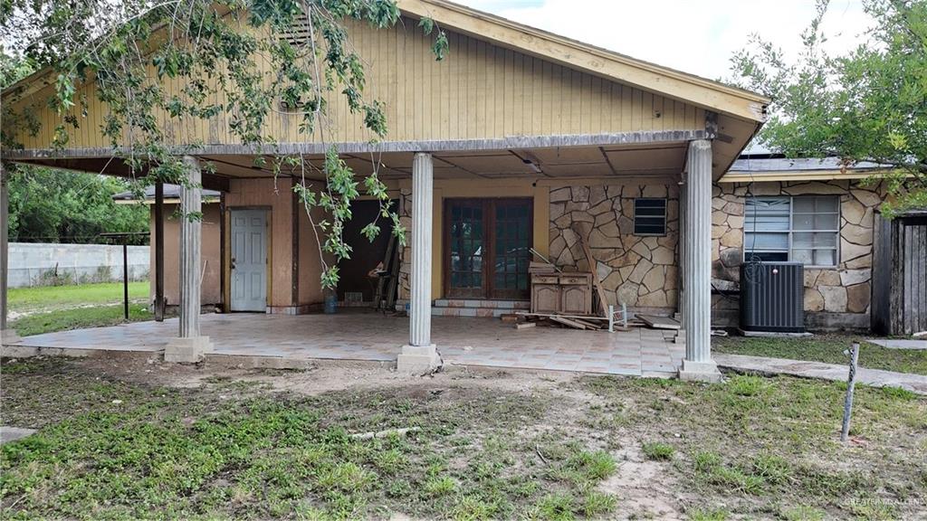 612 West Ramirez Street Rio Grande City, TX 78582 - Photo 10 of 40 Rear view of house with french doors, a patio area, and stone siding