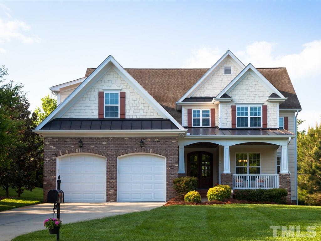 201 Challenge Road Raleigh, NC 27603 - Photo 1 of 25 a front view of a house with garden