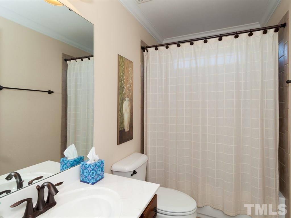 201 Challenge Road Raleigh, NC 27603 - Photo 15 of 25 a bathroom with a sink toilet and shower