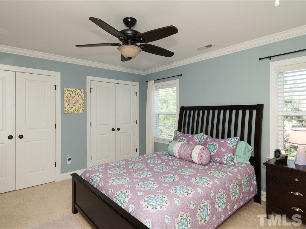 201 Challenge Road Raleigh, NC 27603 - Photo 16 of 25 a bedroom with a bed and window