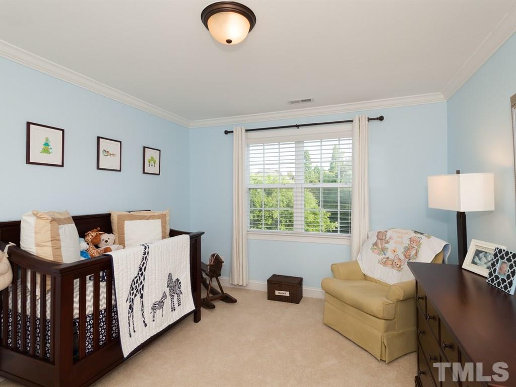 201 Challenge Road Raleigh, NC 27603 - Photo 18 of 25 a bedroom with furniture and a window