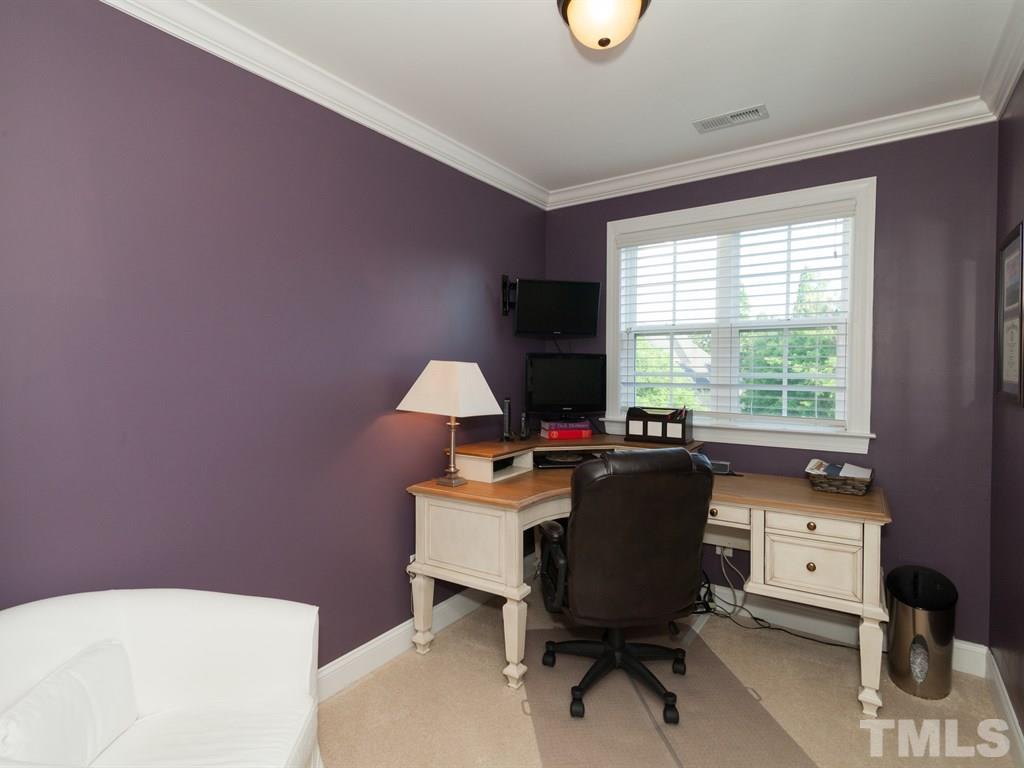201 Challenge Road Raleigh, NC 27603 - Photo 19 of 25 a view of a workspace with furniture and a window