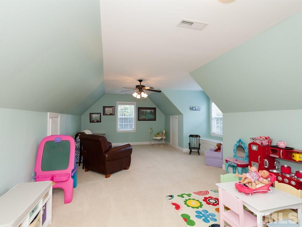 201 Challenge Road Raleigh, NC 27603 - Photo 20 of 25 a bedroom with furniture and a bed