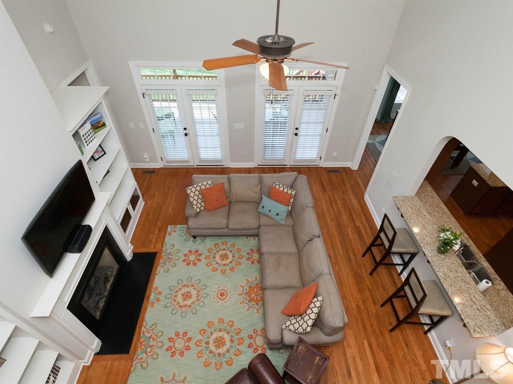 201 Challenge Road Raleigh, NC 27603 - Photo 22 of 25 a view of a living room with furniture and a flat screen tv