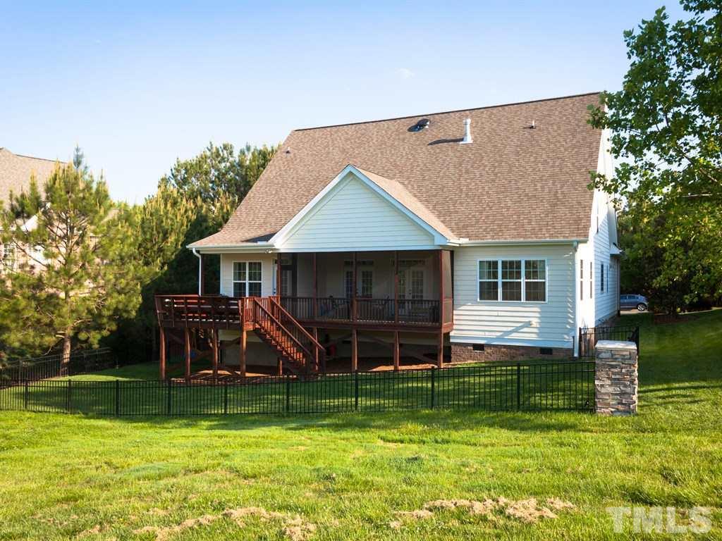 201 Challenge Road Raleigh, NC 27603 - Photo 25 of 25 a front view of a house with a yard table and chairs