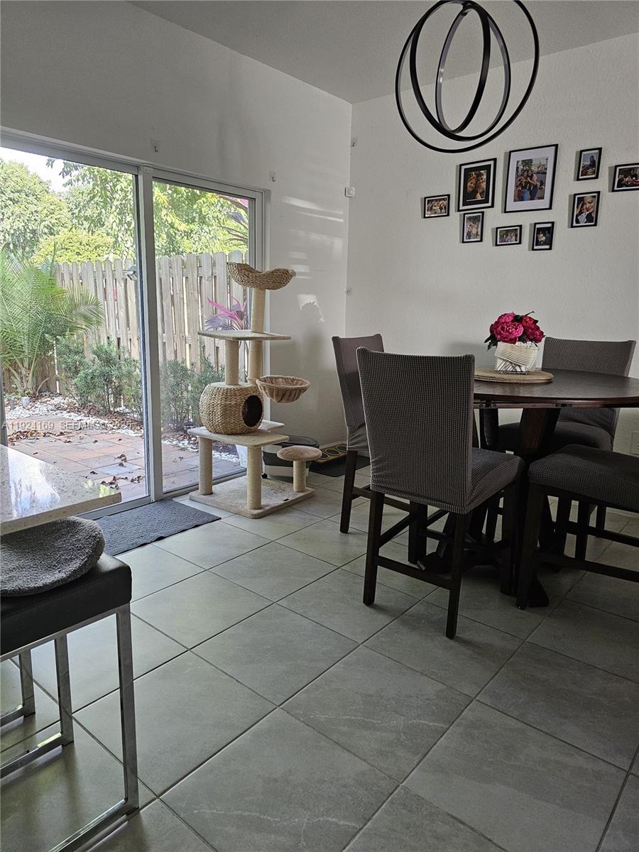 2637 Southeast 17th Street Homestead, FL 33035 - Photo 11 of 23 a view of a dining room with furniture window and outside view