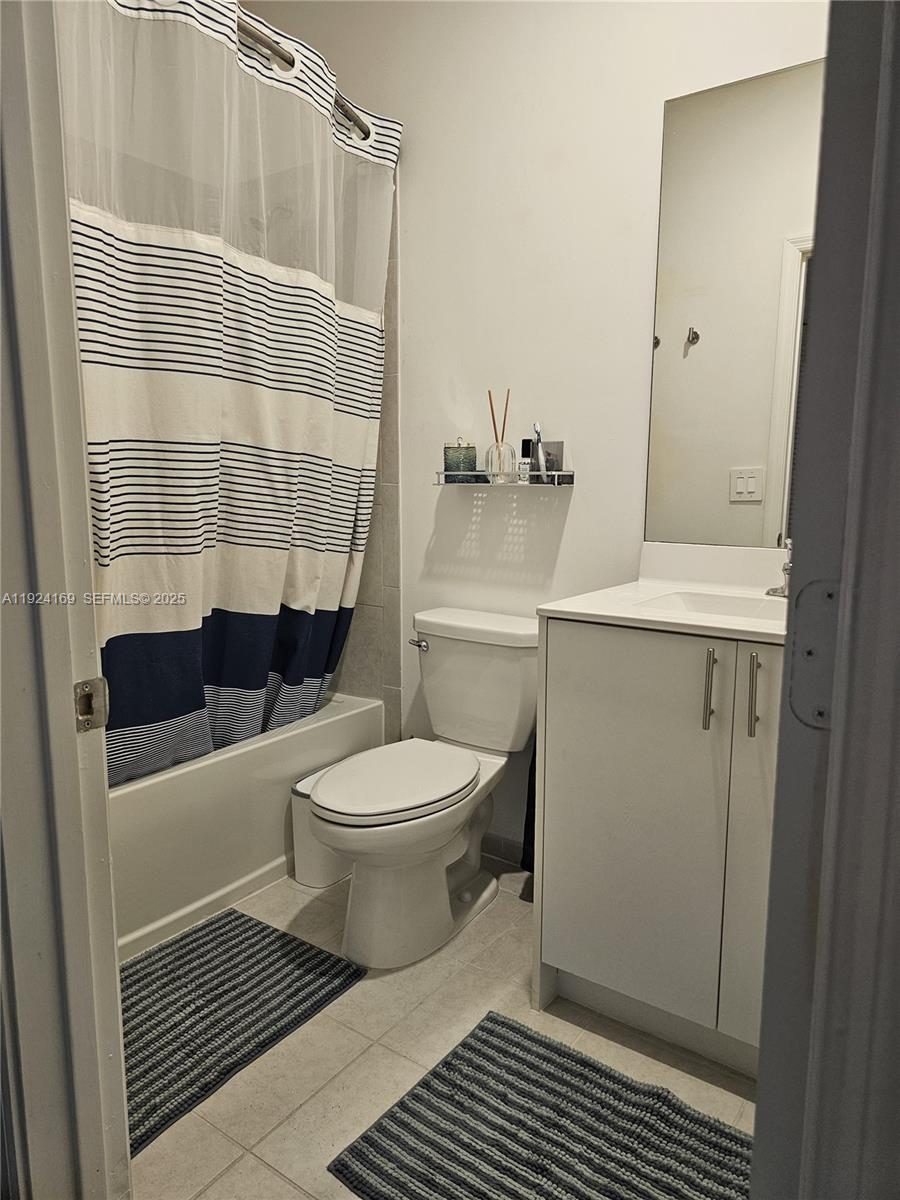 2637 Southeast 17th Street Homestead, FL 33035 - Photo 12 of 23 a bathroom with a toilet a sink and a shower