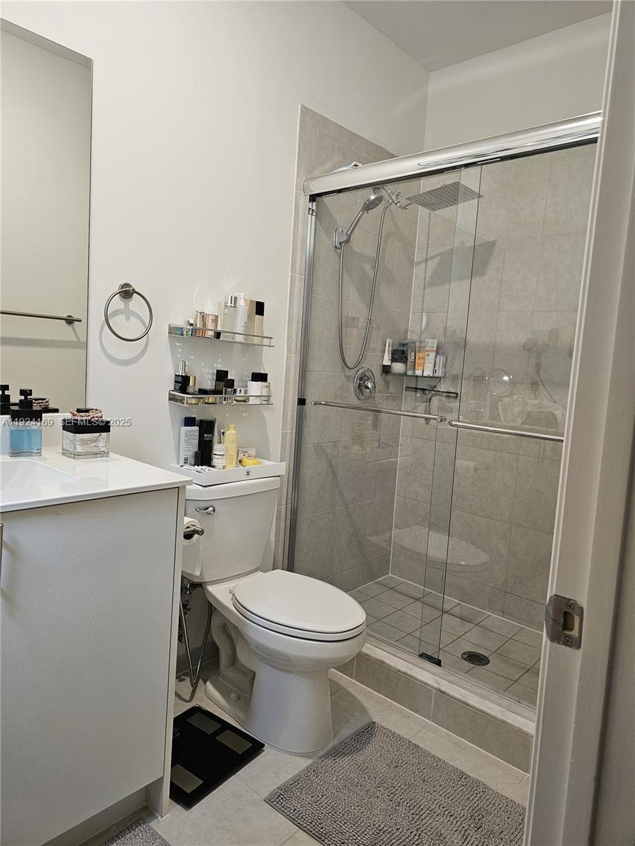 2637 Southeast 17th Street Homestead, FL 33035 - Photo 13 of 23 a bathroom with a shower a toilet and a sink