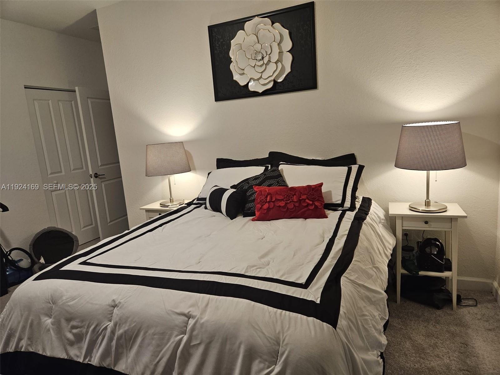 2637 Southeast 17th Street Homestead, FL 33035 - Photo 20 of 23 a bedroom with a bed and a lamp