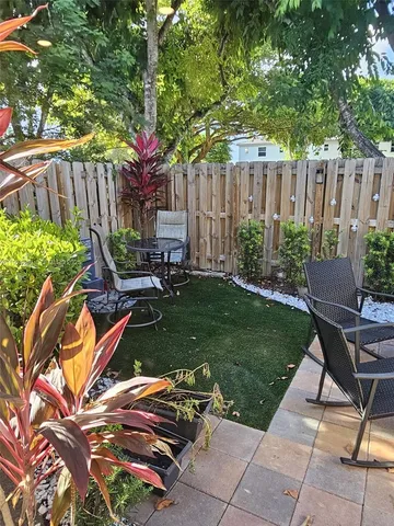 a garden view with a seating space