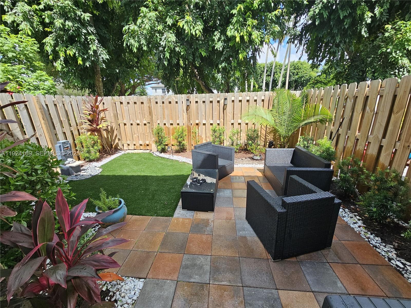 2637 Southeast 17th Street Homestead, FL 33035 - Photo 22 of 23 a view of garden with patio