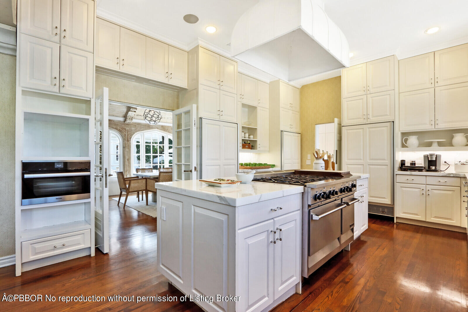 210 Via Del Mar Palm Beach, FL 33480 - Photo 27 of 85 a kitchen with stainless steel appliances granite countertop a stove top oven a sink dishwasher a refrigerator and white cabinets with wooden floor