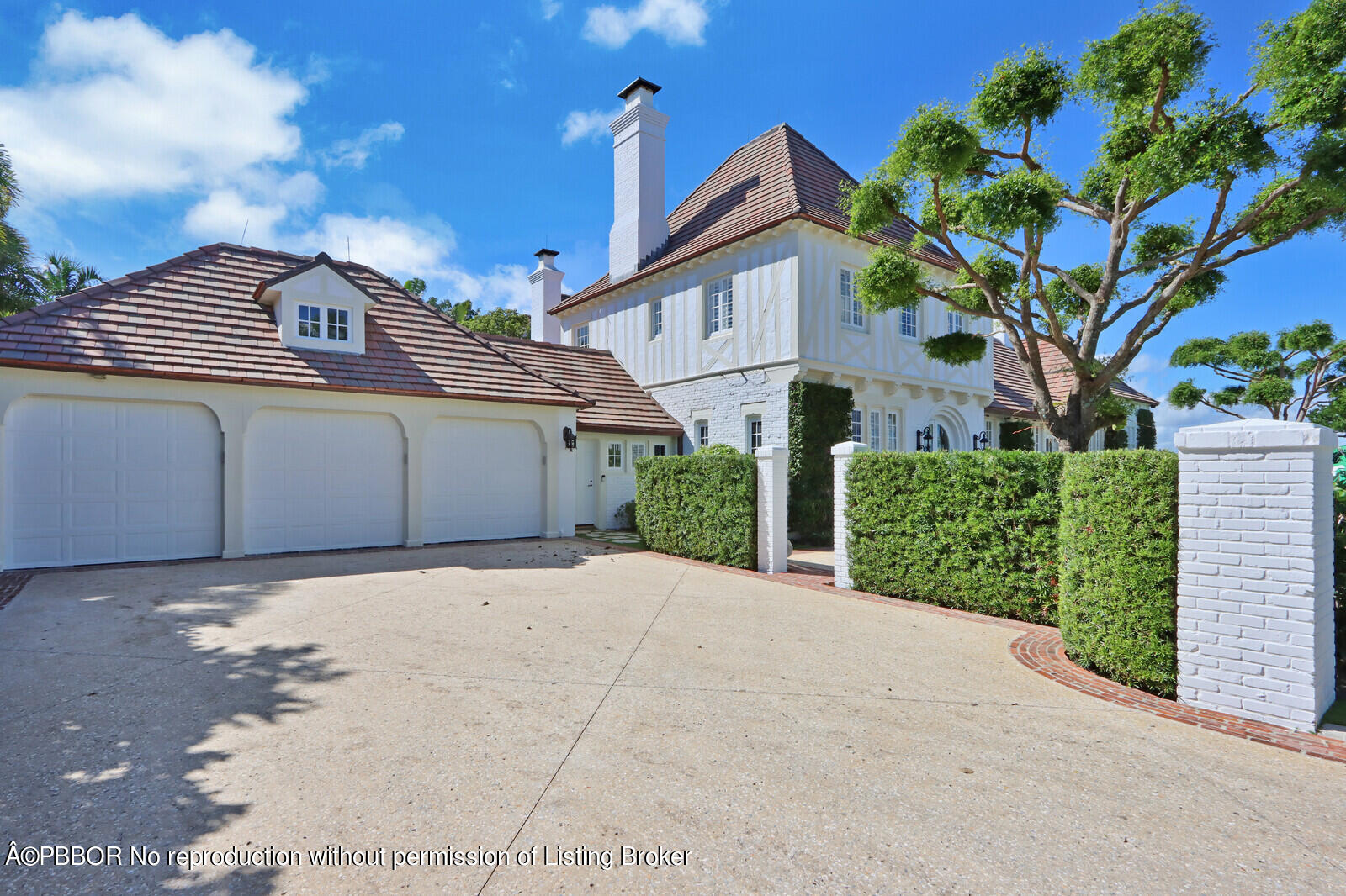 210 Via Del Mar Palm Beach, FL 33480 - Photo 3 of 85 a view of a white house with a yard and potted plants