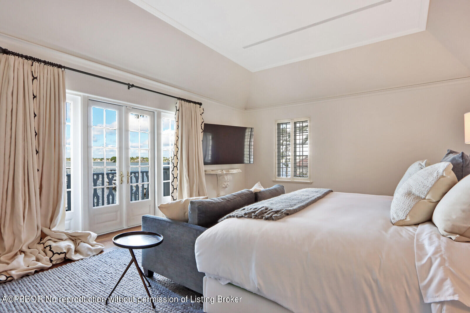 210 Via Del Mar Palm Beach, FL 33480 - Photo 36 of 85 a bedroom with a bed and glass door