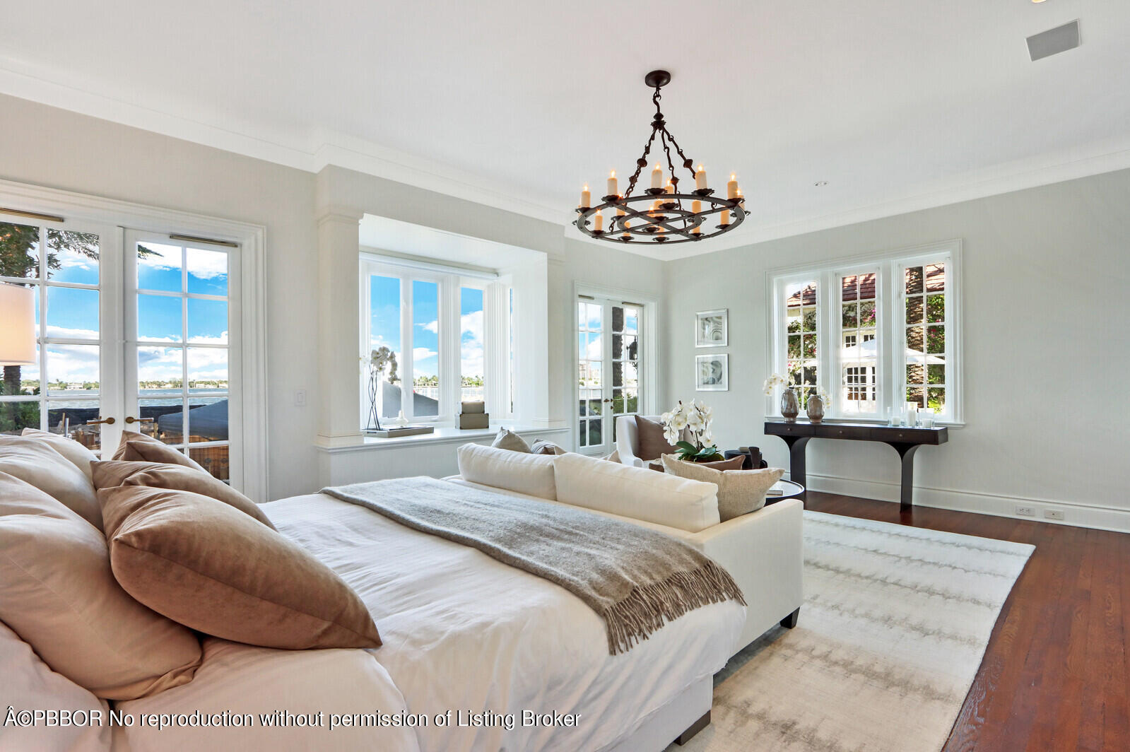 210 Via Del Mar Palm Beach, FL 33480 - Photo 51 of 85 a bedroom with a bed next to a window and a chandelier