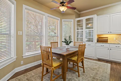 a dining room with furniture and window