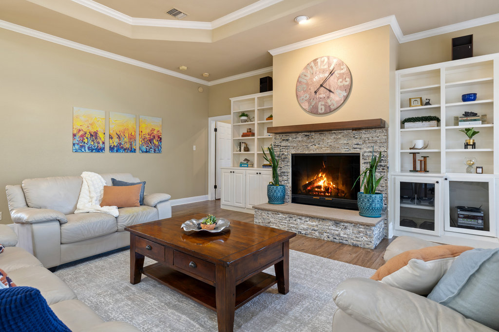 3507 Bee Creek Road Spicewood, TX 78669 - Photo 13 of 40 a living room with furniture and a fireplace