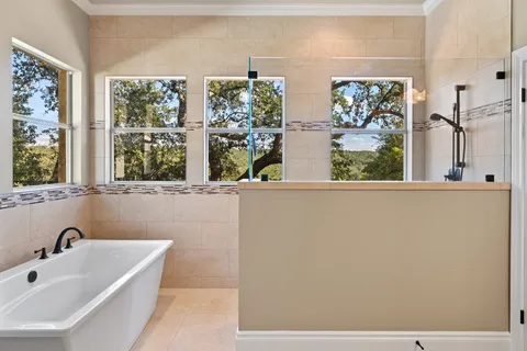 a bathroom with a bathtub and a sink