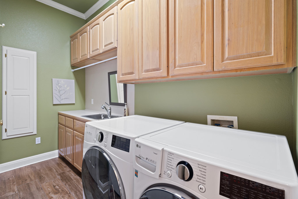 3507 Bee Creek Road Spicewood, TX 78669 - Photo 28 of 40 a utility room with dryer and washer