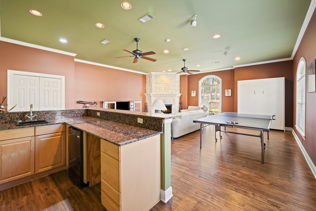 3507 Bee Creek Road Spicewood, TX 78669 - Photo 29 of 40 a kitchen with a stove and a sink
