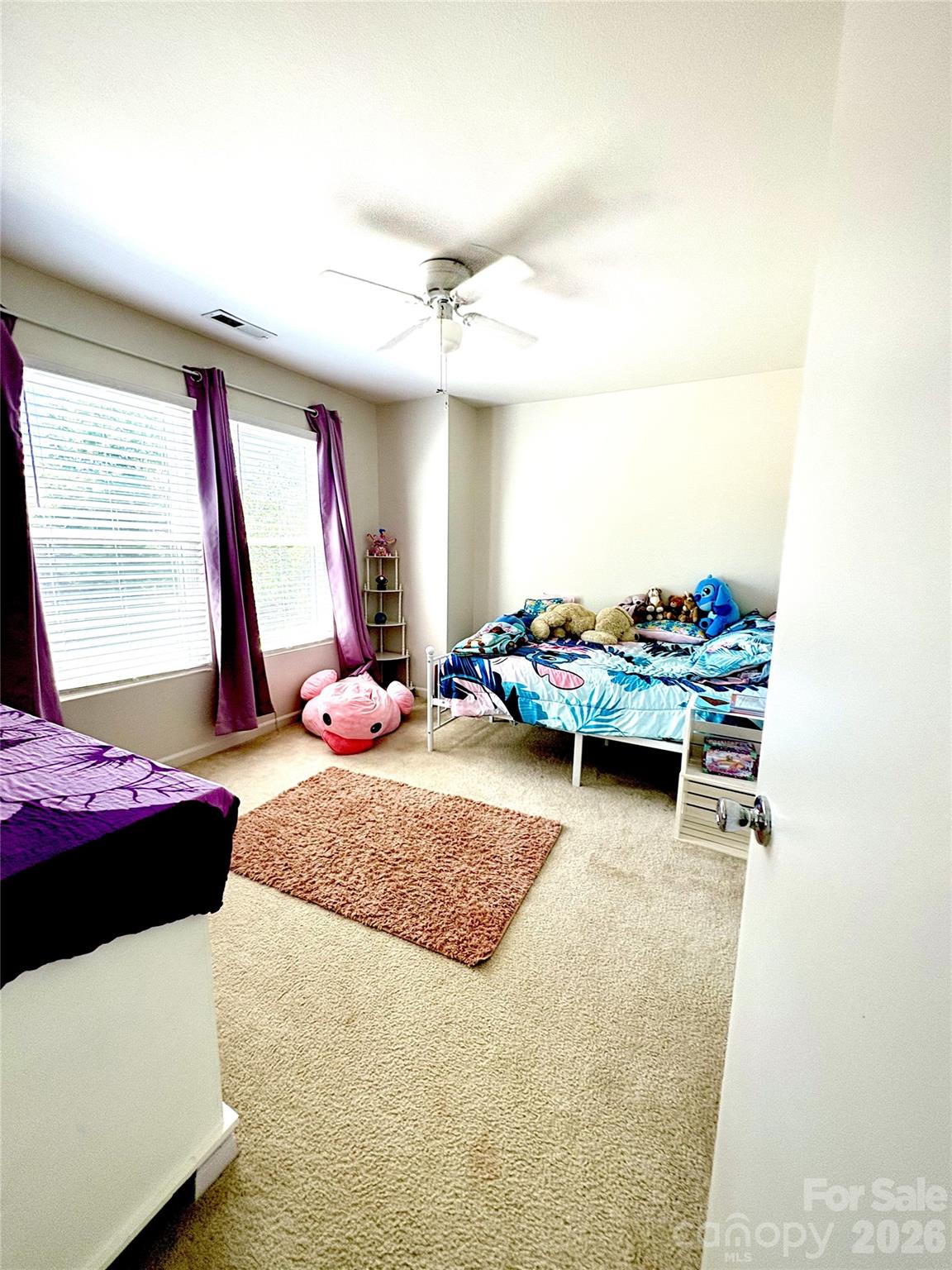 2514 Spring Breeze Way Monroe, NC 28110 - Photo 18 of 25 a bedroom with bed and window