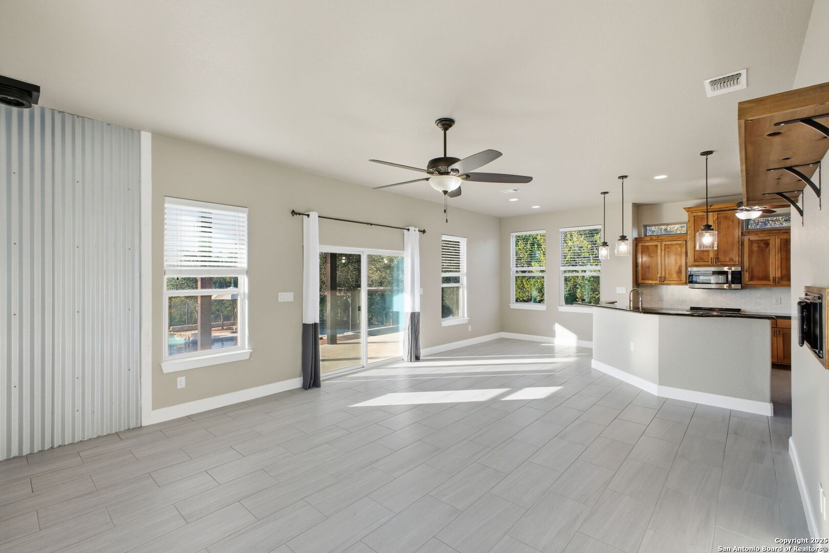 1275 Mystic Breeze Spring Branch, TX 78070 - Photo 11 of 50 a view of a kitchen with a sink and dishwasher a refrigerator with wooden floor