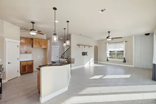 a very nice looking room with kitchen area