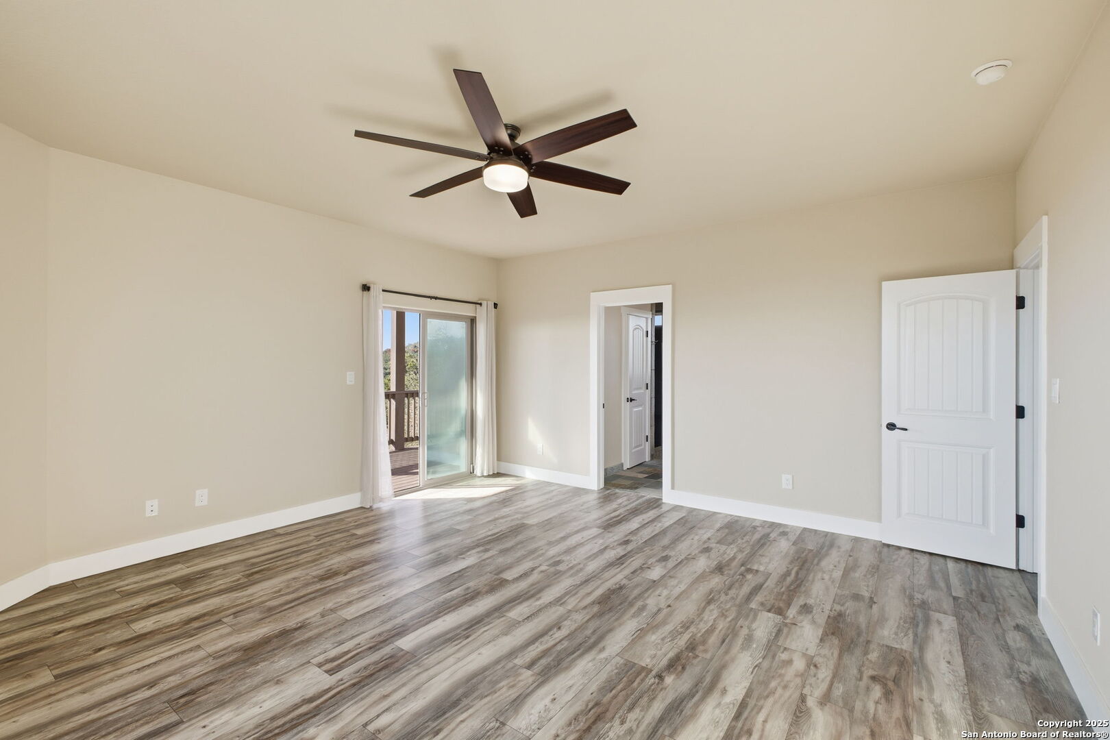 1275 Mystic Breeze Spring Branch, TX 78070 - Photo 22 of 50 a view of a livingroom with a hardwood floor and a ceiling fan