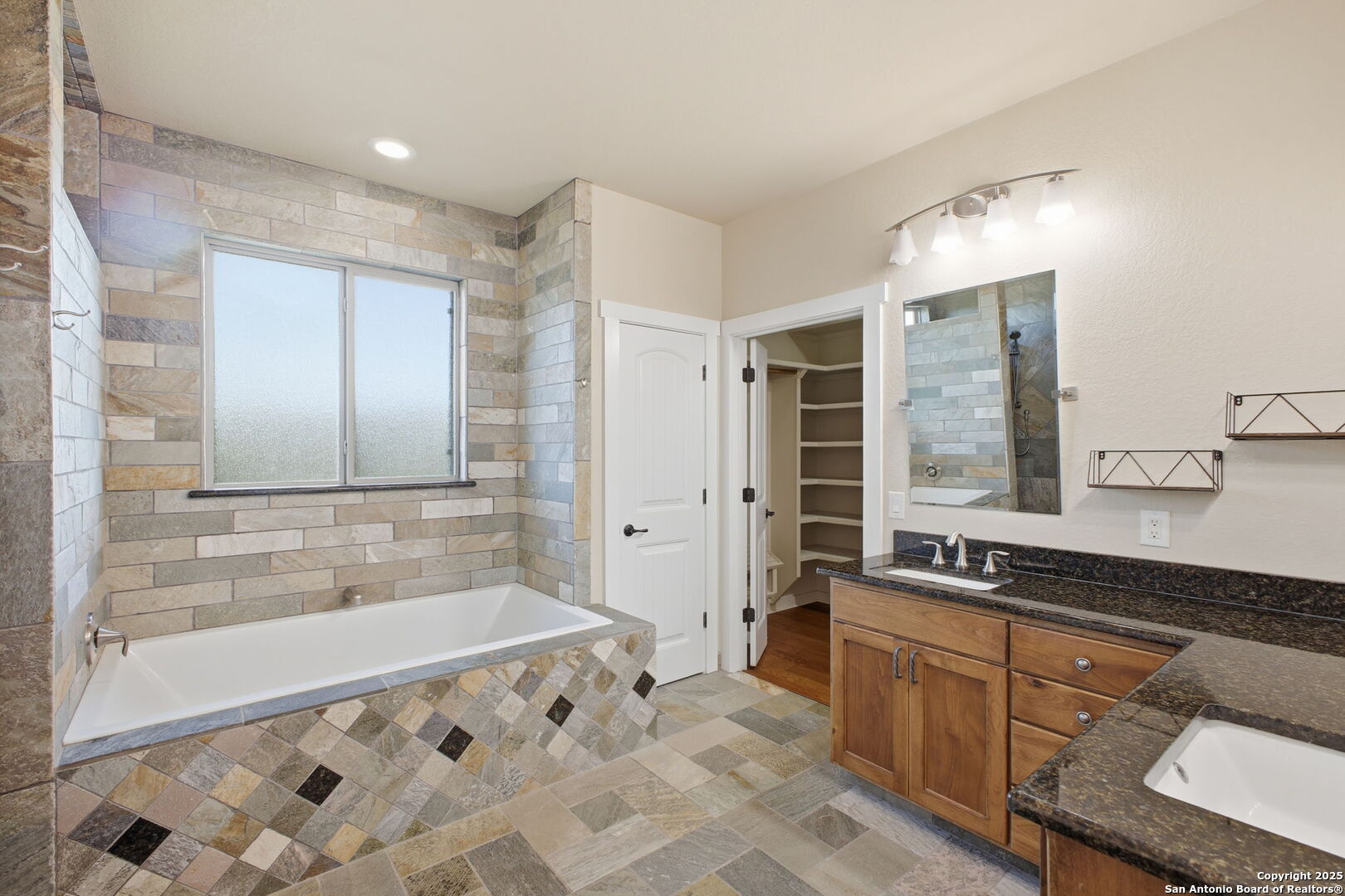 1275 Mystic Breeze Spring Branch, TX 78070 - Photo 23 of 50 a spacious bathroom with a bathtub sink and mirror