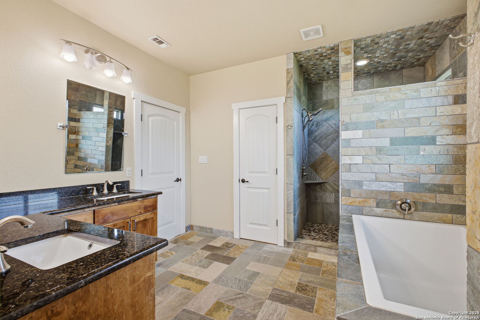 1275 Mystic Breeze Spring Branch, TX 78070 - Photo 24 of 50 a bathroom with a granite countertop sink and a mirror