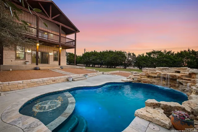 a view of a swimming pool with a patio