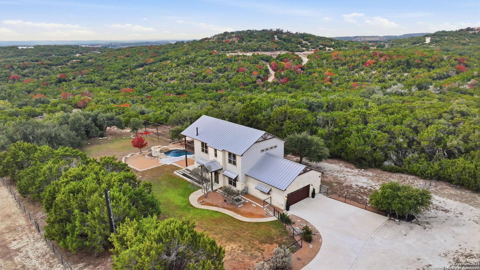1275 Mystic Breeze Spring Branch, TX 78070 - Photo 43 of 50 an aerial view of a house with garden space and trees all around