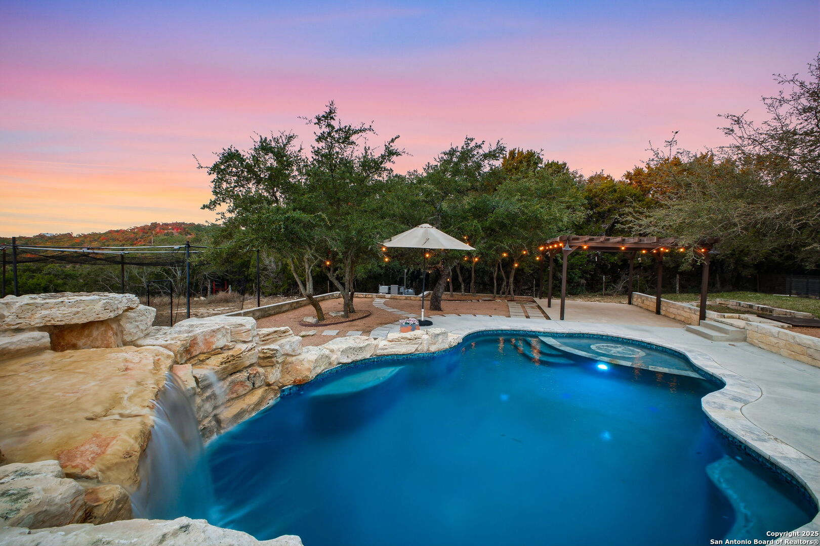 1275 Mystic Breeze Spring Branch, TX 78070 - Photo 48 of 50 a view of swimming pool with seating space and trees in the background