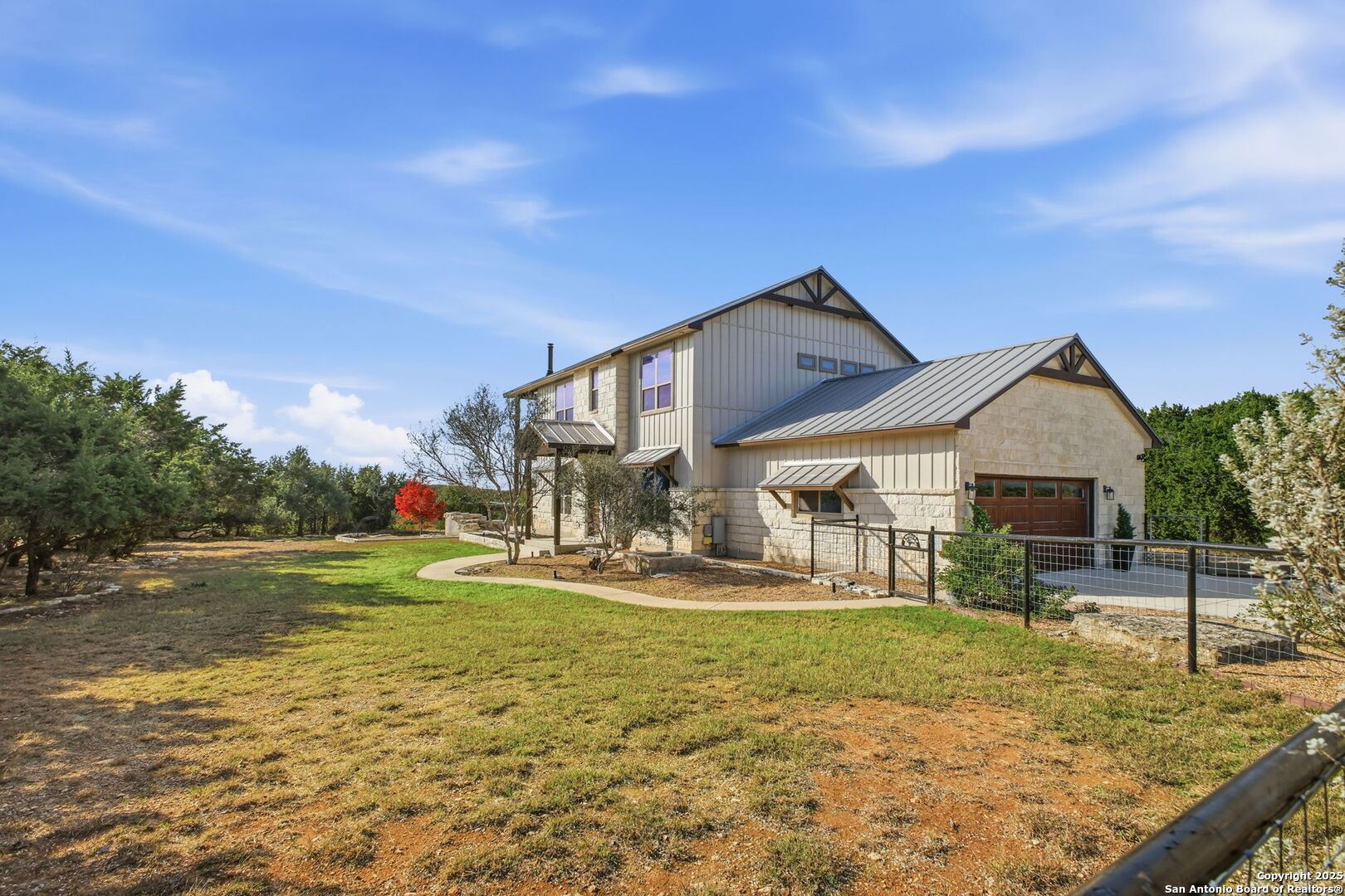 1275 Mystic Breeze Spring Branch, TX 78070 - Photo 49 of 50 a front view of a house with garden