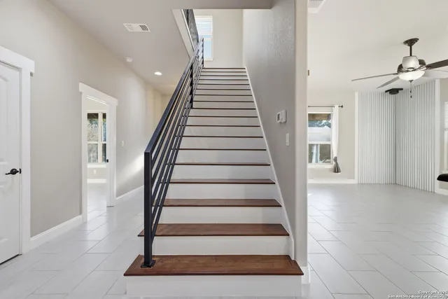 a view of staircase with white walls